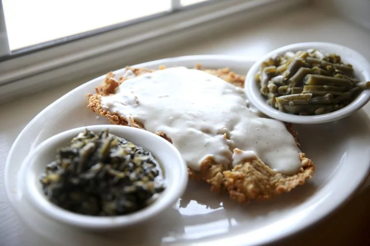 The Delta Cafe signature dishes Chicken Fried Steak, Fried Catfish, Meatloaf, Mashed Potatoes and Gravy